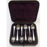 Antique set of British silver tea spoons with extensive matching engraved handles