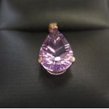 Large solitaire pear cut amethyst set in 9ct yellow imported gold Aprrox 1.3 grams gross,