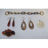 5 items of ladies mid 20thC costume jewellery including amber earrings, mother of pearl, carved