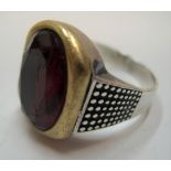 Gents silver ring with large single red stone Approx 13 grams gross, size X/Y