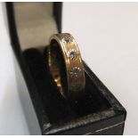 18ct yellow gold eternity ring inset with 14 diamonds Approx 3.7 grams gross, size N