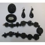 Victorian Whitby jet ladies jewellery mourning set to include an ornately carved choker,