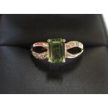 9ct yellow imported gold ring with octagon cut peridot & with small set diamonds to both shoulders