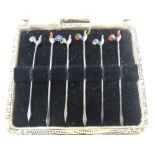 6 hallmarked silver and enamel cocktail sticks in original case Good condition