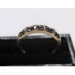 unmarked/untested yellow gold ring with 20 small round cut black diamonds Approx 1.7 grams gross,