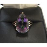9ct yellow imported gold ring with large pear cut mystic topaz with a small diamond to either