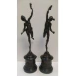 High quality pair of large 19thC Continental school bronze statues on black marble plinths. Both