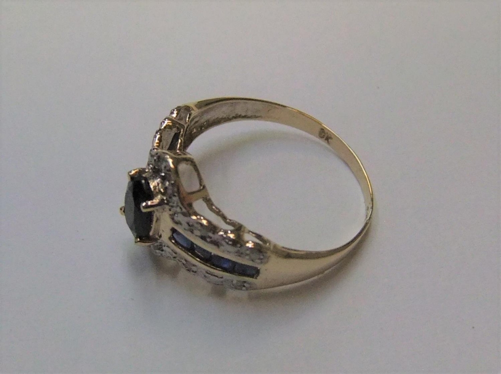 9ct yellow gold imported ring adourned with sapphires & diamonds Approx 1.7 grams gross, size N - Image 3 of 3