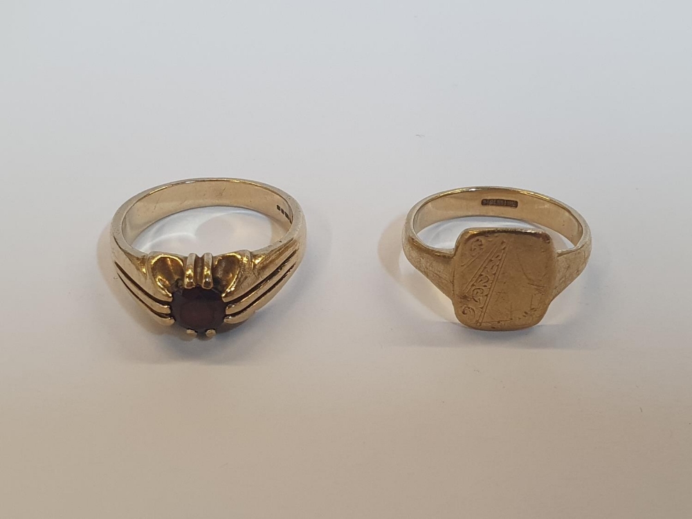 2 x 9ct rings, one yellow gold Garnet ring, and one yellow gold Signet ring. Approx. 10.5 grams