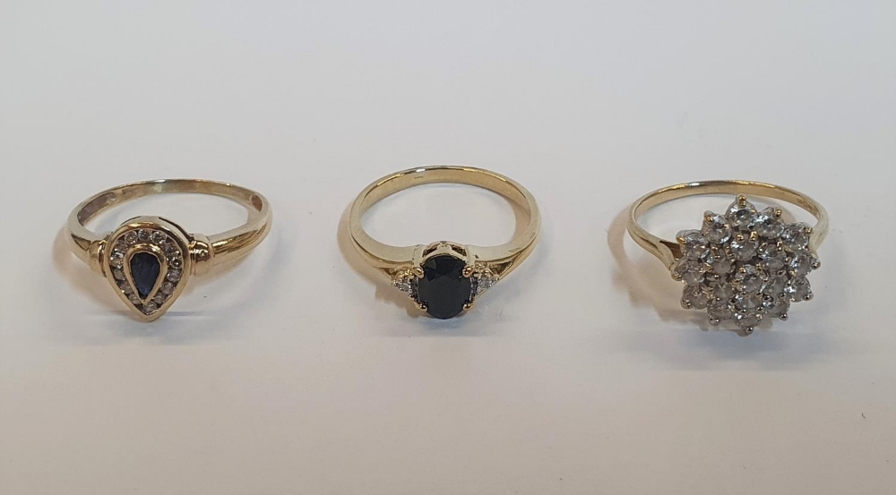 3 x 9ct rings, one yellow gold pear cut Sapphire ring, one yellow gold Sapphire and Diamond ring,