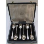 6 Scottish cased, old silver tea spoons with golf logo engraved to each spoon