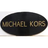 Large, double sided oval, wooden MICHAEL KORS sign 34 x 69 cm