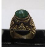 Medieval style metal ring (probably bronze) with green cabouchon stone