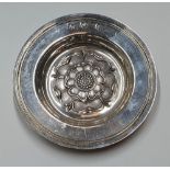 Hallmarked 20thC circular silver dish embossed with the English rose and extensively engraved to