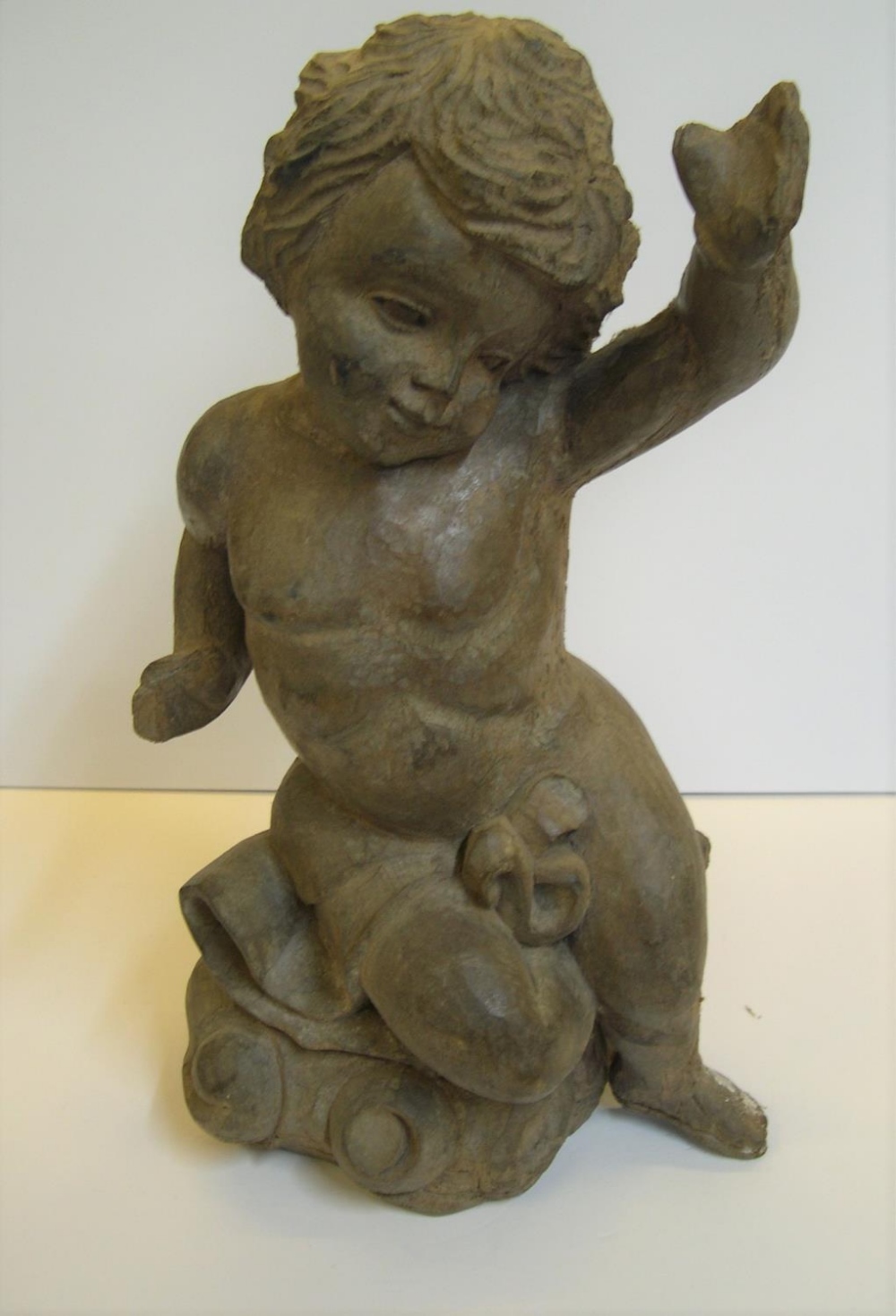 17th/18thC Central European wood carving of a Putti, 42 cms high