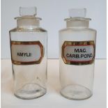 2 large, good quality Chemist bottles with original labels, complete with glass stoppers, 24 cm high