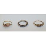 3 9ct gold rings to include an eternity ring with clear stones, a Garnet and diamond ring and a