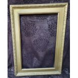 1 large gilt and gesso antique frame, some losses. Internal measurements - 79 x 49.