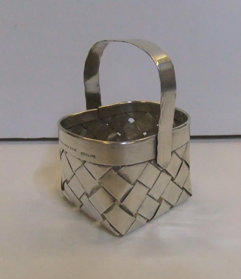 Charming miniature silver basket by Cartier, 6 cm long