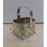 Charming miniature silver basket by Cartier, 6 cm long