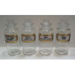 4 medium sized matching antique chemist bottles with complete labels