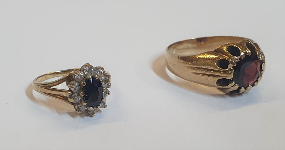 2 yellow gold rings, 1 a heavy garnet solitaire, the other a Sapphire dress ring flanked by CZ ( - Image 3 of 3