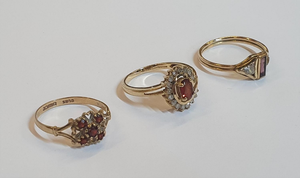 3 gold rings to include a 9ct yellow gold & oval cut Garnet surrounded by diamonds, another 9ct gold - Image 2 of 2