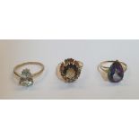 3, 9ct yellow gold rings (3), the first a large pear cut Topaz with diamond chips. the 2nd, a