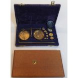 Cased set of Scales and weights complete with wooden screw in base