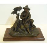 Early 20thC Bronze statue of Peasant boy at rest with his faithful dog , housed on wooden stand,