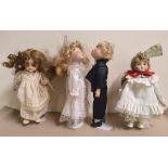 4 porcelain decorative large dolls all on metal stands, All measure approx 37 cm in height