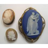 3 old cameo brooches, the largest stamped Wedgewood verso, Largest measures 5 x 4 cm
