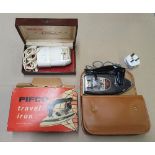 Boxed, vintage Remington electric shaver together with a boxed vintage "Pifco" travel iron (2),