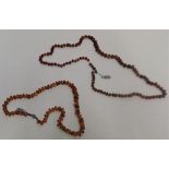 Pair of Amber necklaces, 44cm and 74cm