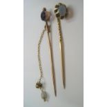 2 antique unmarked 9ct stickpins, 1 with an opal, the other amethyst, 3.6 grams
