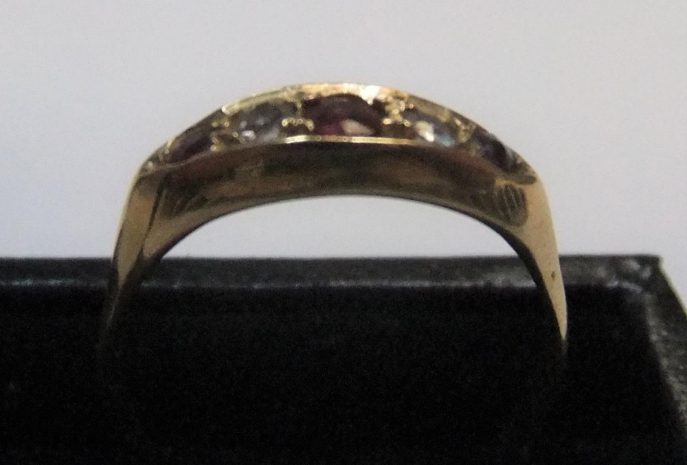 18ct yellow gold boat shaped ring with rubies & diamonds Approx 2.7 grams gross, size O/P