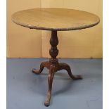 Georgian folding mahogany tripod table, The table top measures 74 cm in diameter