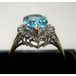 stunning 9ct yellow gold pear cut blue topaz surrounded by diamonds Approx 3.4 grams gross size P