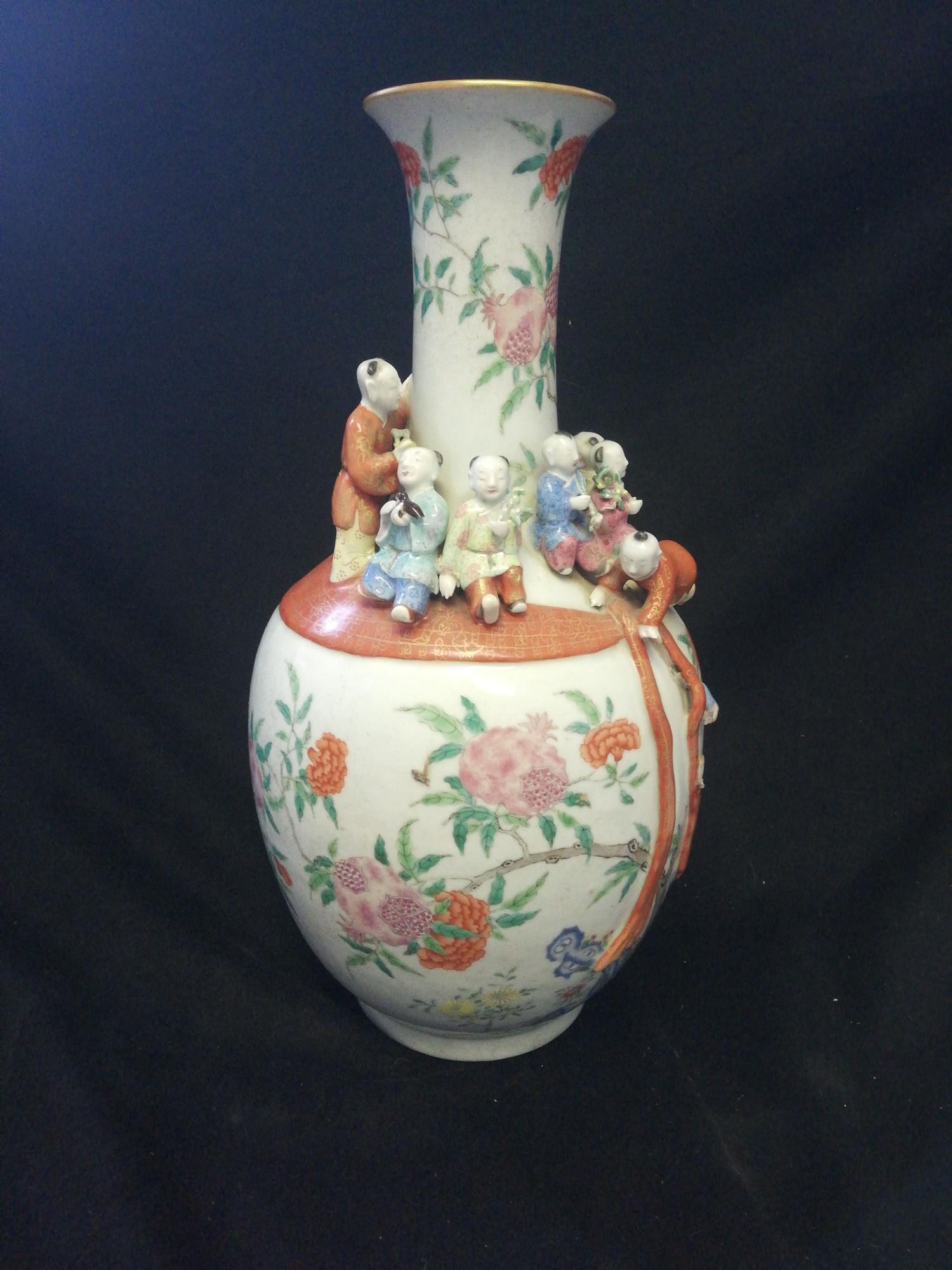 Chinese floral decorated vase with applied clambering boys - with obvious damage & marks obliterated