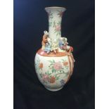 Chinese floral decorated vase with applied clambering boys - with obvious damage & marks obliterated