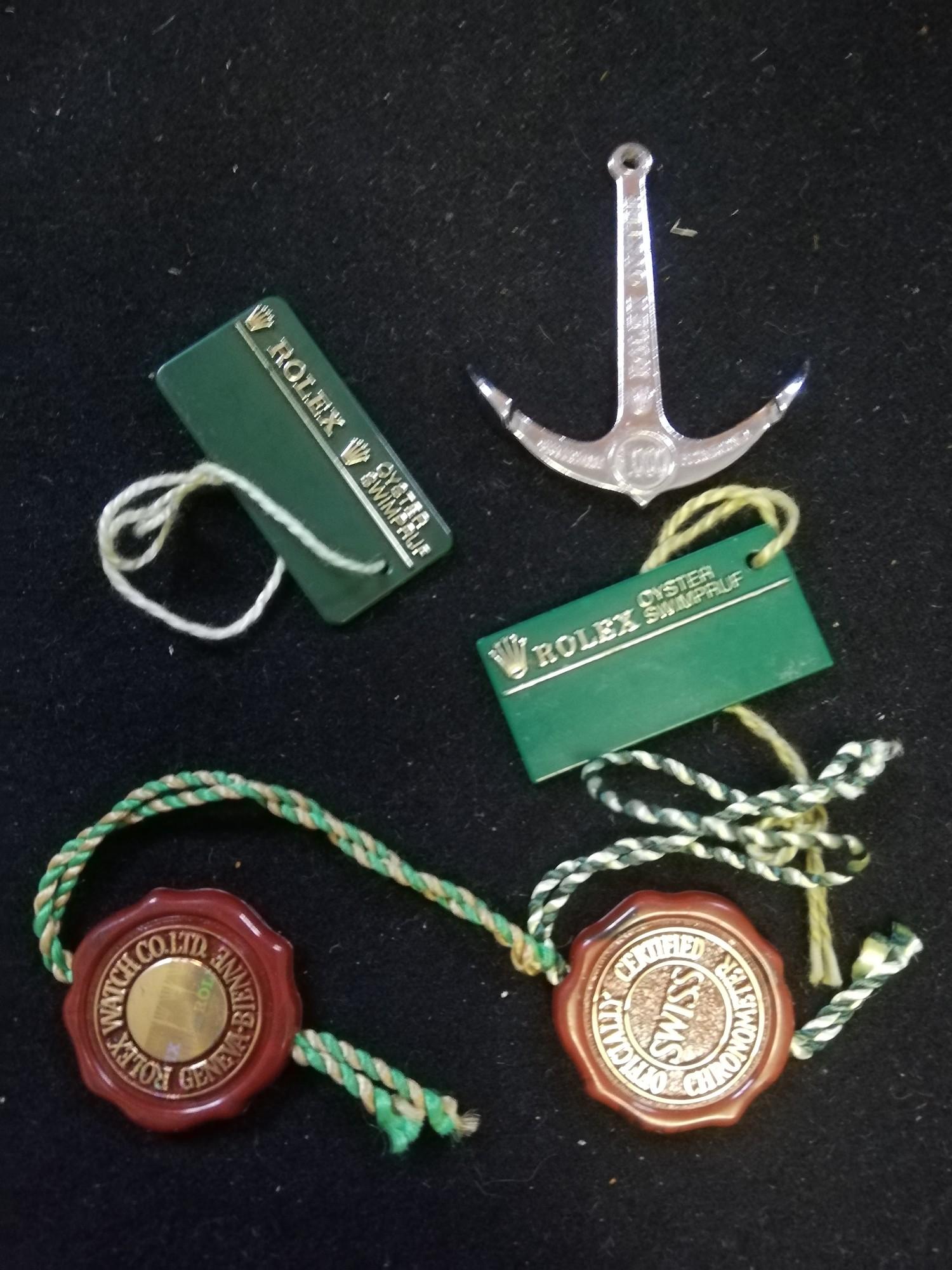 Rolex 300m oyster submariner anchor t/w 2 x price tags & 2 x swing tags