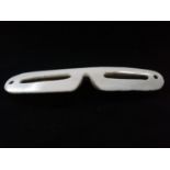 Inuit pair of snow goggles carved from bone -7" long