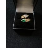 Emerald and Diamond pear shaped stones crossover ring