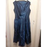 Blue silk taffeta 1950's sleeveless dress with handstitched diamante decoration with silk bow