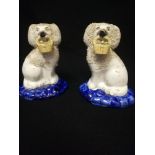 Pair of Staffordshire spaniels with baskets of flowers held in mouths -5½" tall -BW on bases