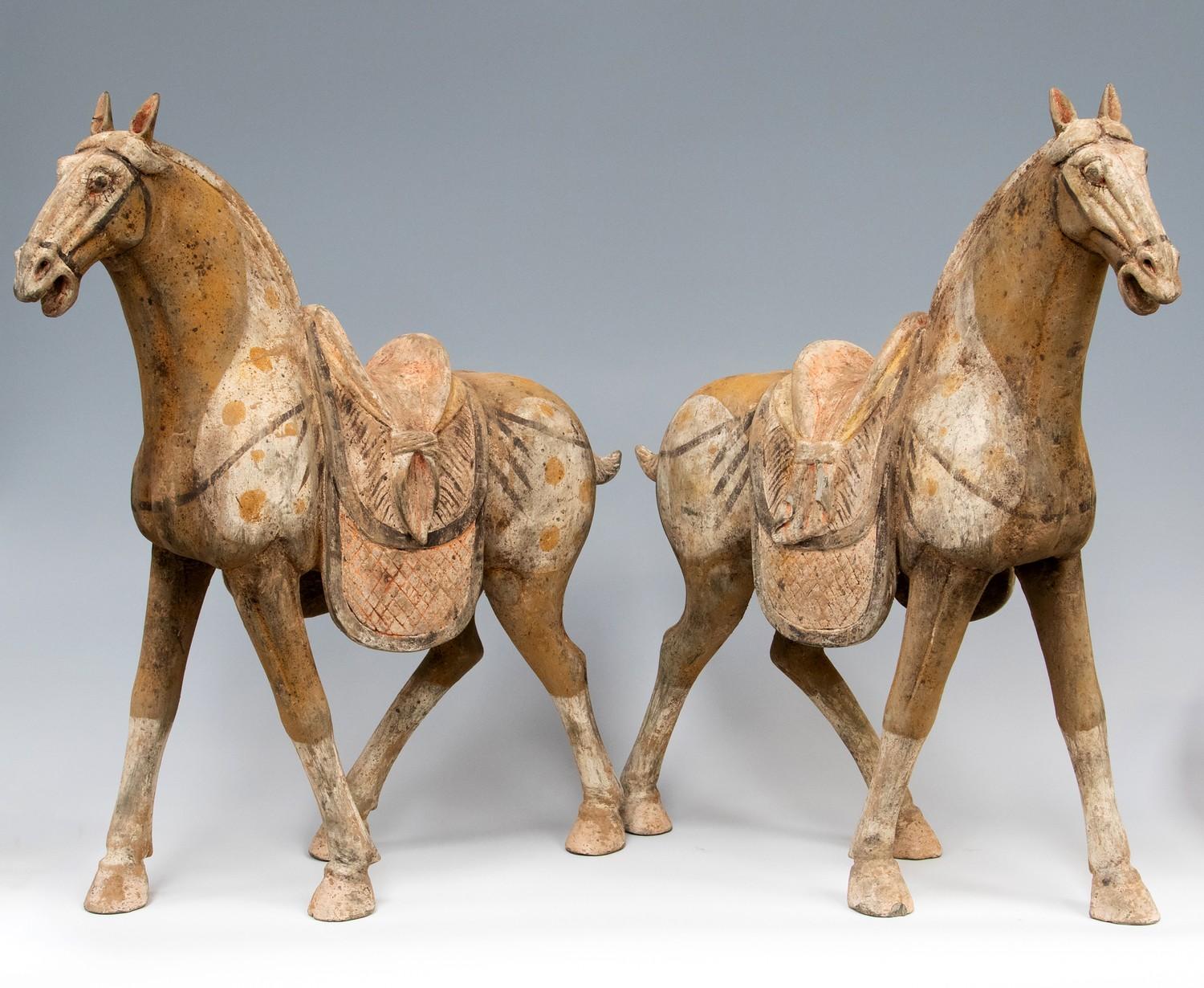 Large pair of Tang dynasty painted pottery horses with saddles (618-907AD) -22" x 20"