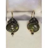 Pair of drop earrings set with cabochon peridot and diamonds