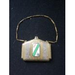 1930's American vanity case / compact designed as a bag with enamelled plaque to front