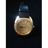 Garrard gold plated wristwatch with automatic movement in worn condition with inscription to back