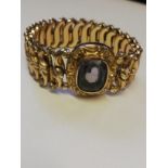 Minerva rolled gold expanding bracelet with amethyst central stone